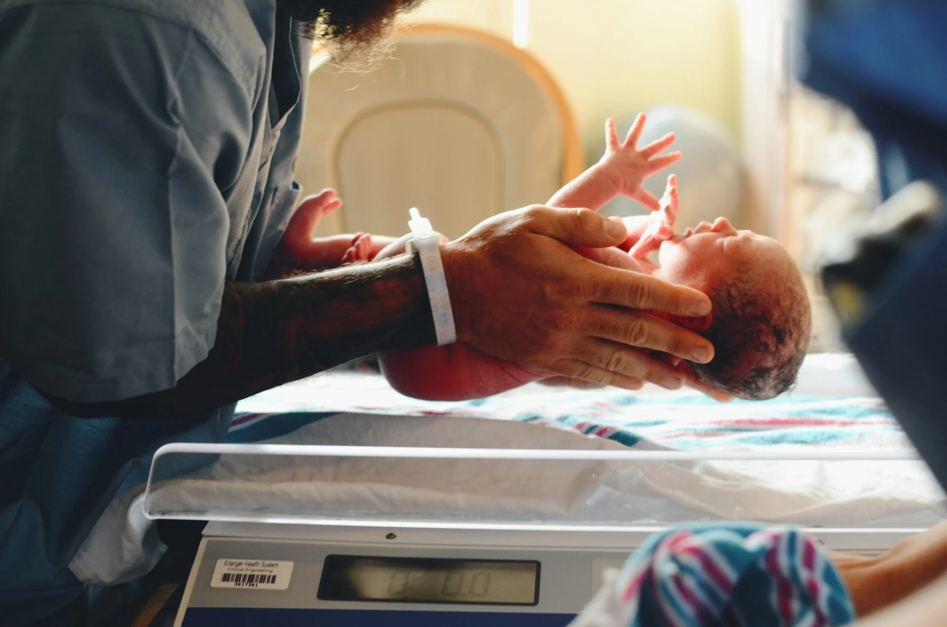 Newborn being weighed