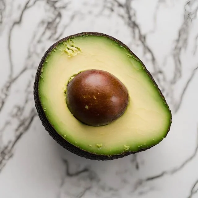 An avocado sliced in half