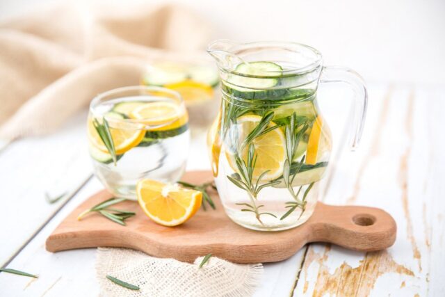 jug of water with lemon in it