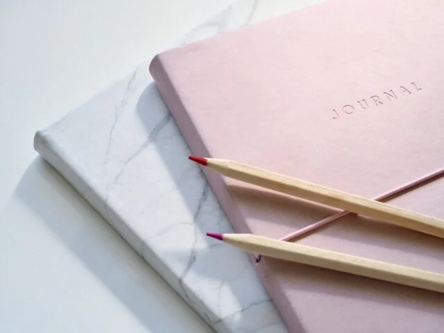 Two notebooks and pencils