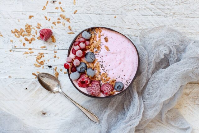 A bowl with berry smoothie inside